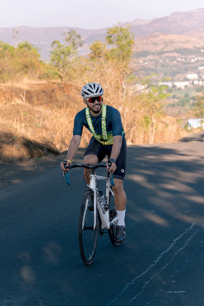 Man cycling wearing Araku Snug-fit cycling jersey