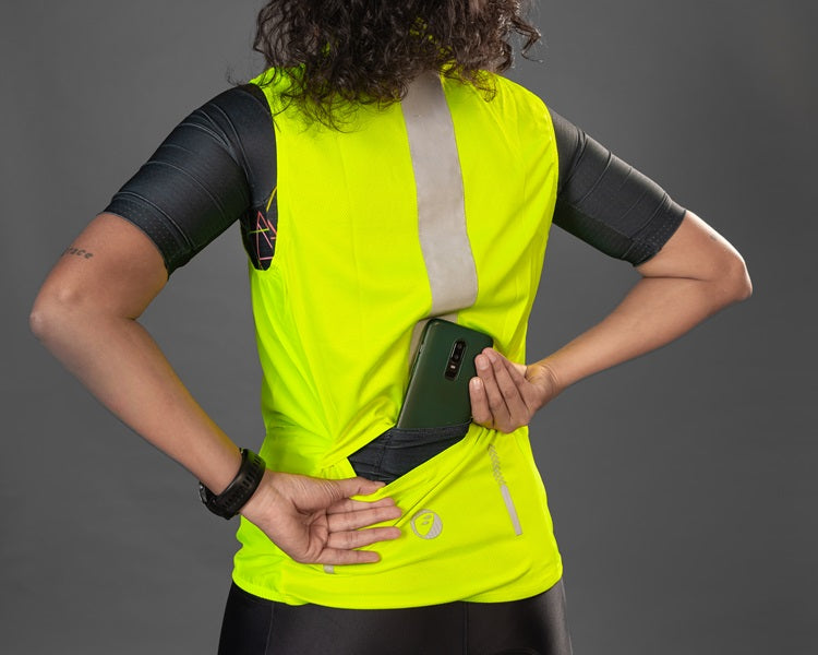 Women wearing Neon colored Gilet Sleeveless Cycling Jacket showcasing its back pocket